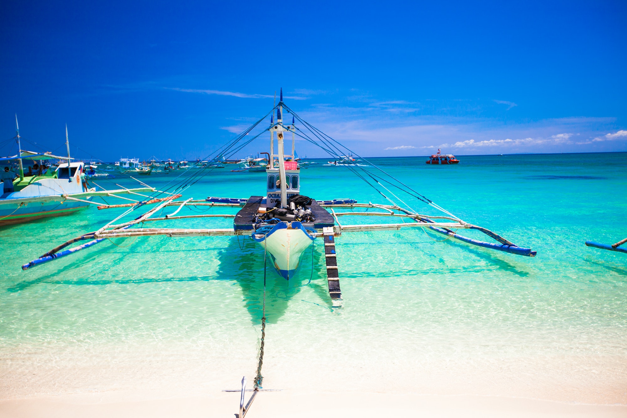 Filipino boat in the turquoise sea, Boracay, Philippines